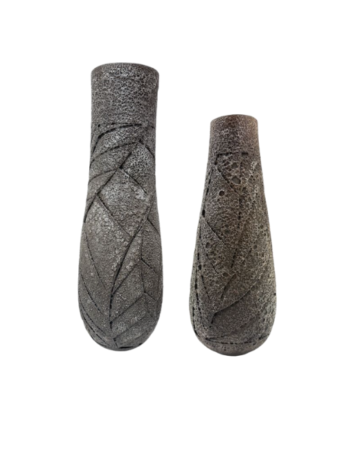 two tall dark textured ceramic vessels