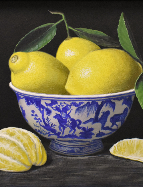 still life painting of a white and blue ceramic bowl of lemons with a peeled lemon on the table on a dark background
