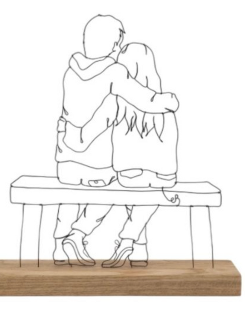 wire art of a couple sat on bench on a wooden base
