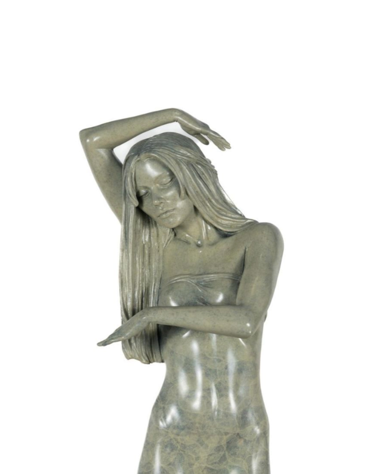Statue of a woman with long hair on a white background