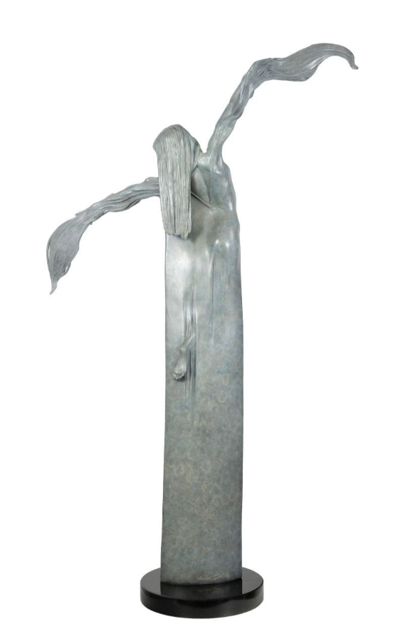 Decorative sculpture of a woman with flowing hair on a white background