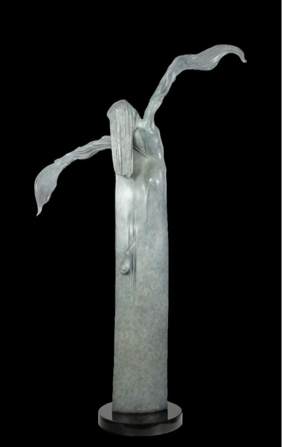 Abstract sculpture with flowing forms on a black background