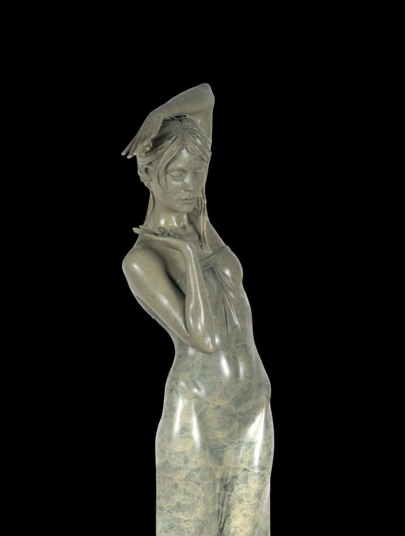 Statue of a womanon a black background