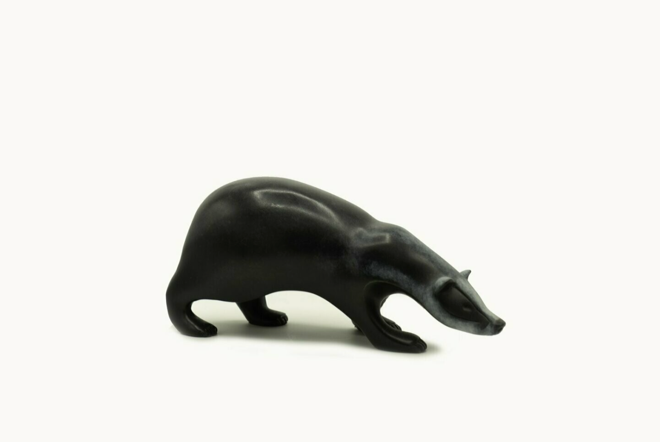 Black bear figurine on a white background