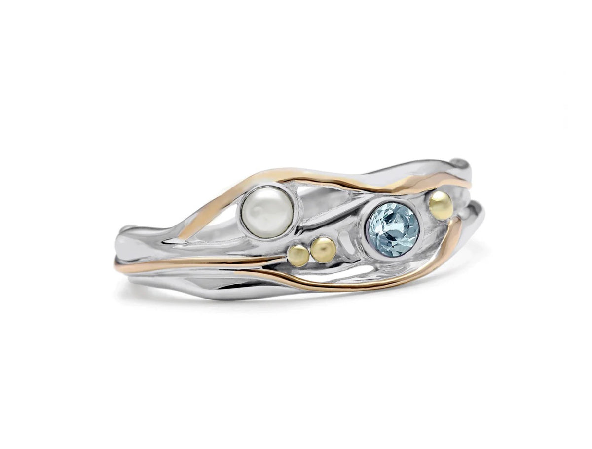 Two-finger ring with gold and silver band featuring gemstones on a white background