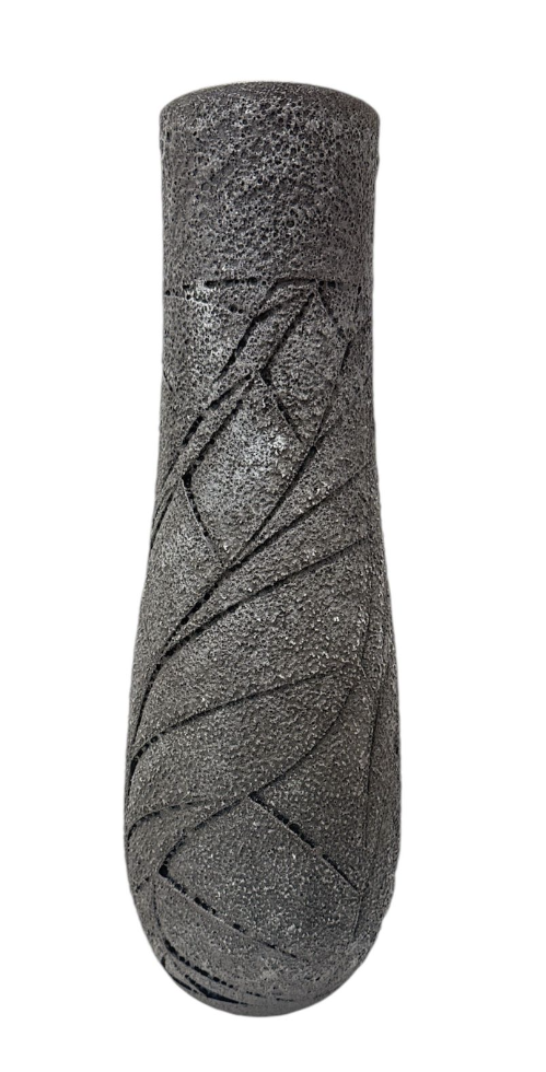 Textured black cylindrical object on a white background