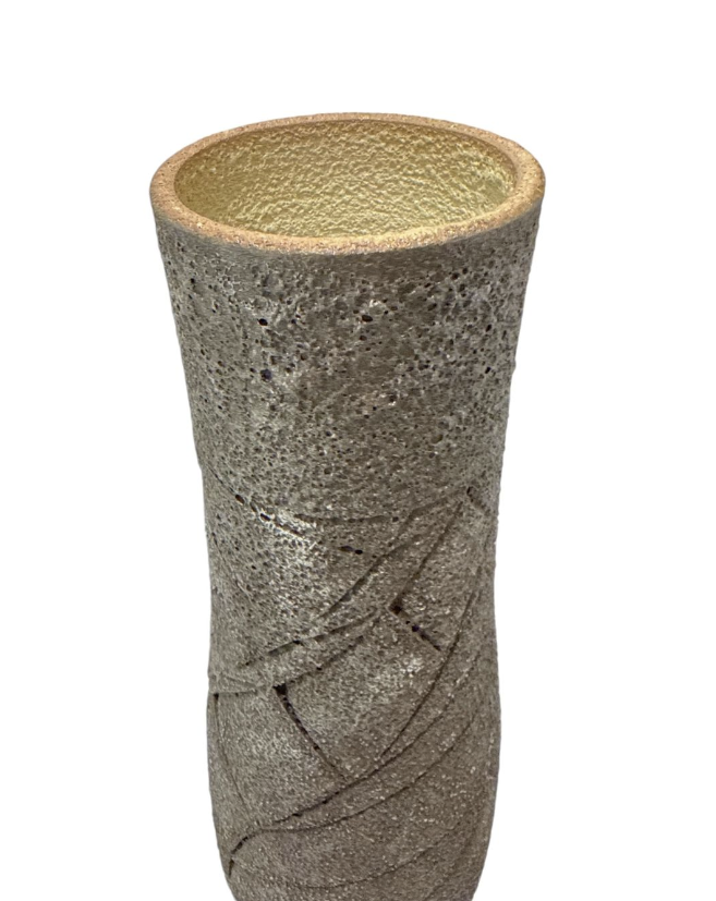 Textured cylindrical vase on a white background