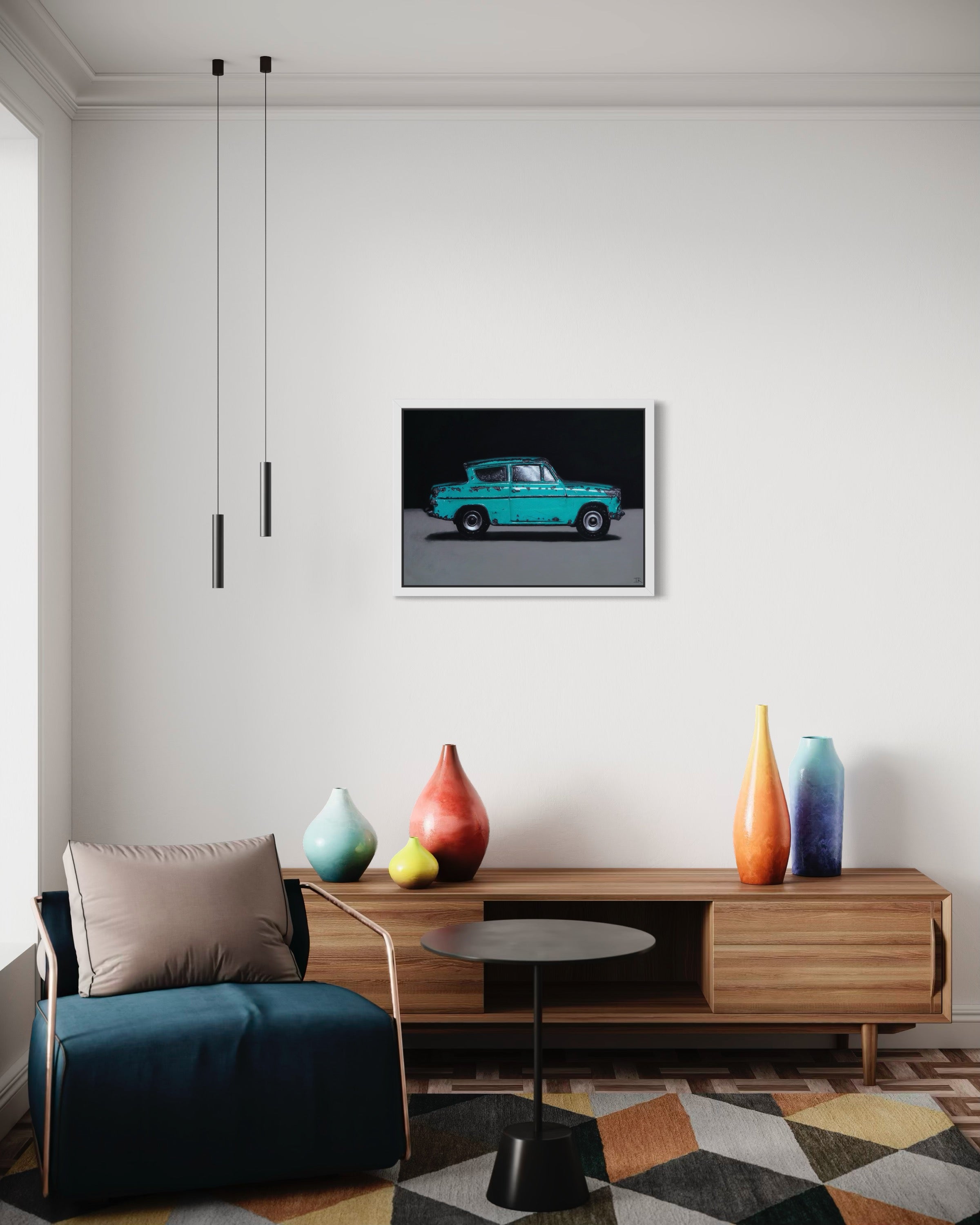 Modern living room with a framed original pastel of a turquoise car on the wall, wooden cabinet with colorful vases, and a blue sofa.