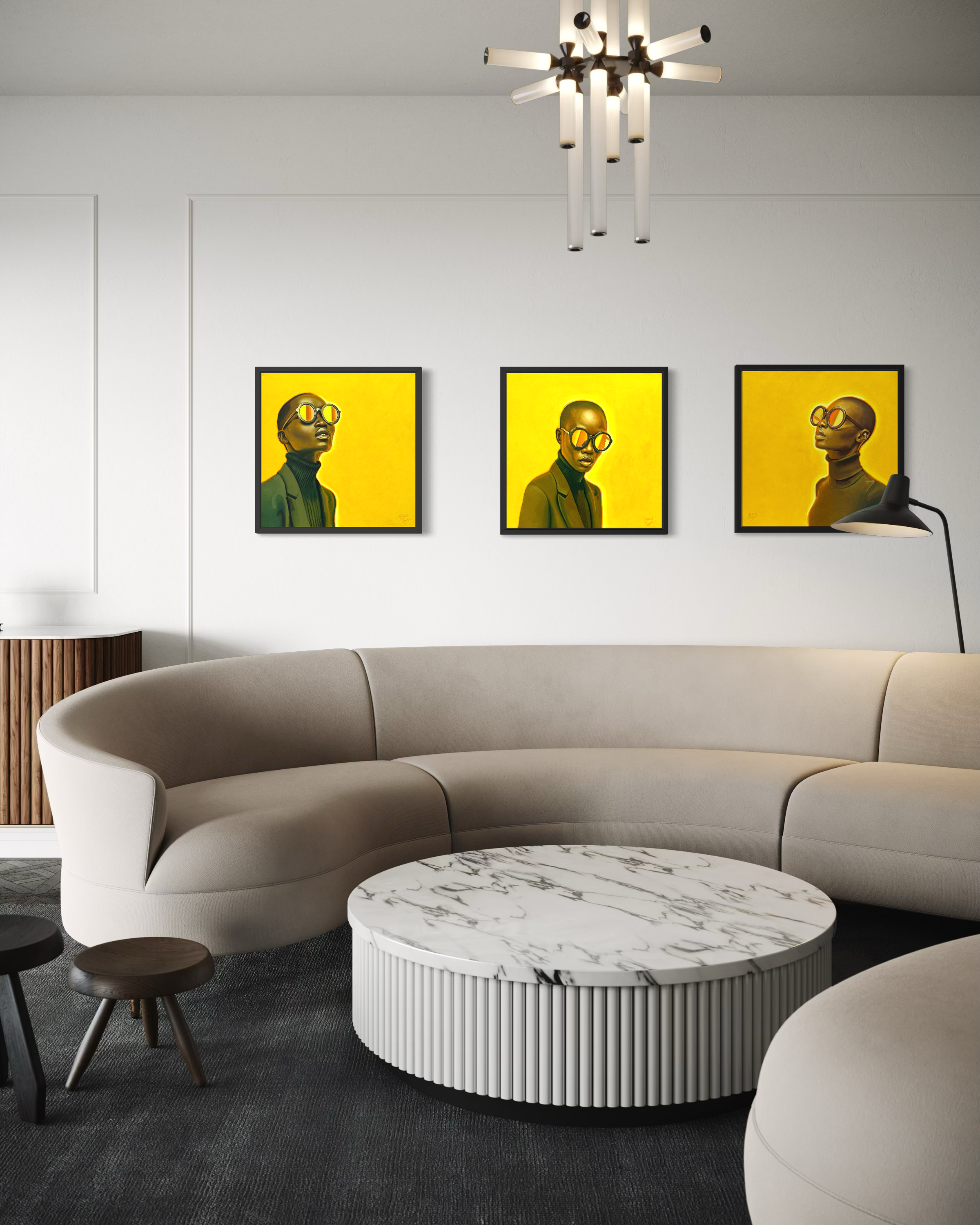 Modern living room with a curved beige sofa, round marble coffee table, and three yellow-framed Ella Nicole artworks on the wall.