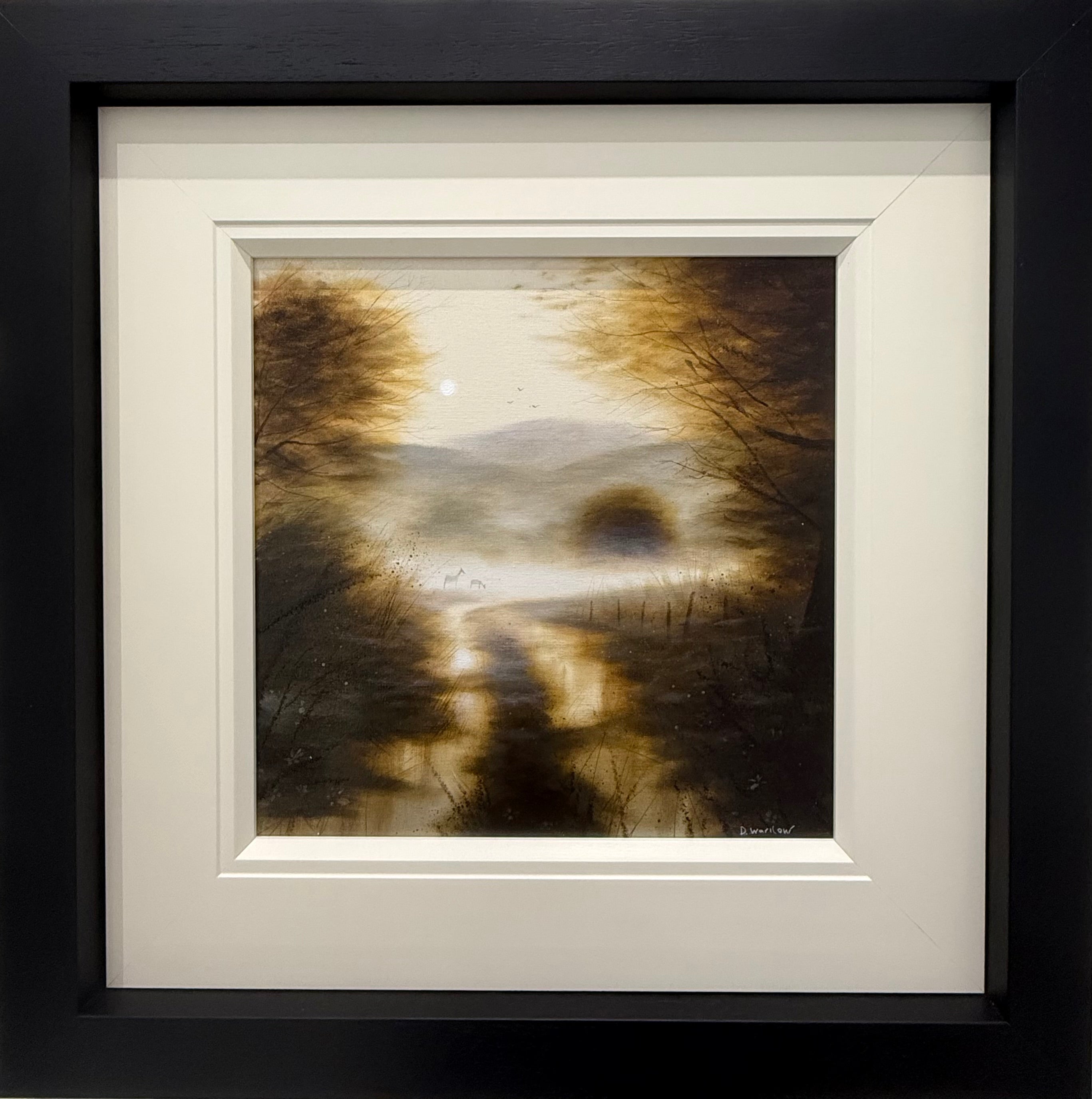 Framed artwork of a landscape with trees and a sunset, monochrome sepia