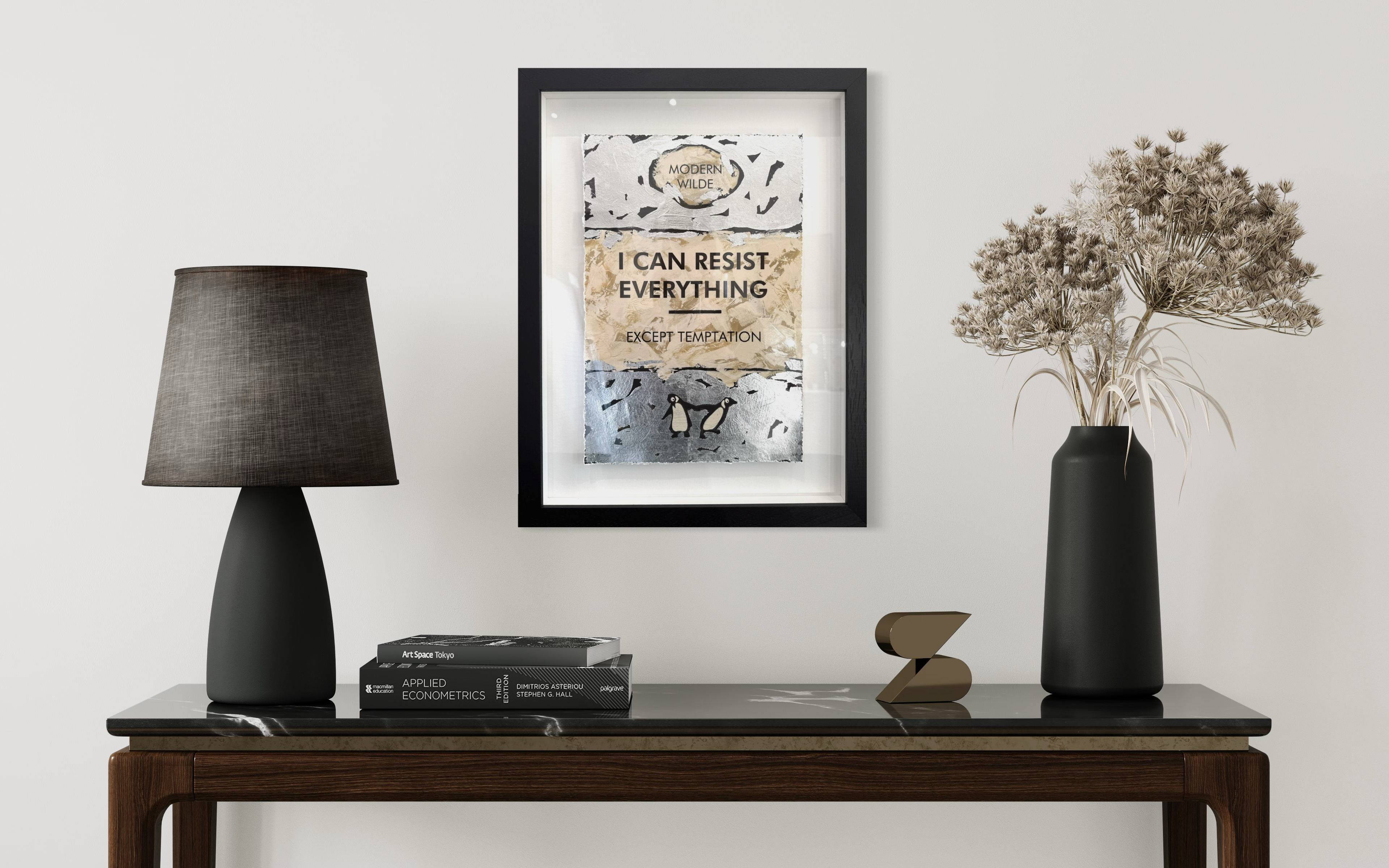 Framed motivational poster on a wall above a wooden console table with decor items.