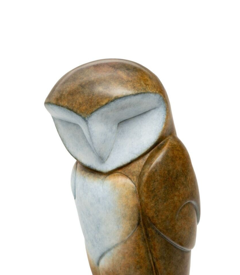 Stylized owl sculpture with brown and white colours on a white background