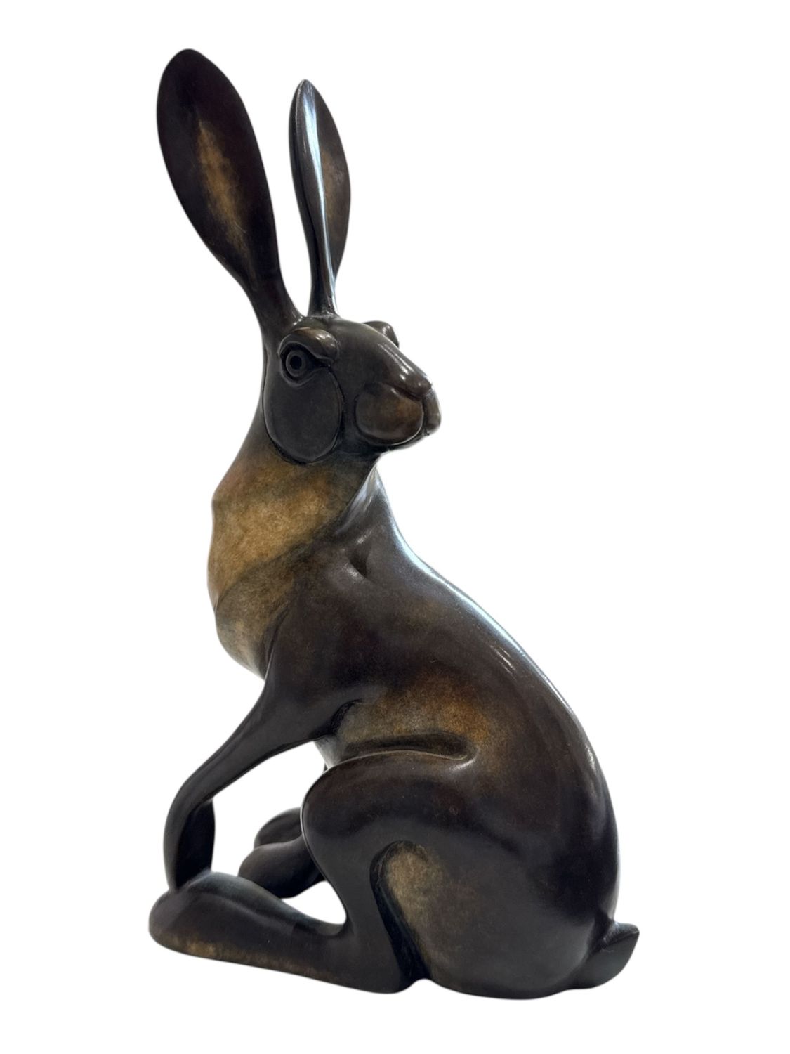 Bronze sculpture of a sitting hare on a white background