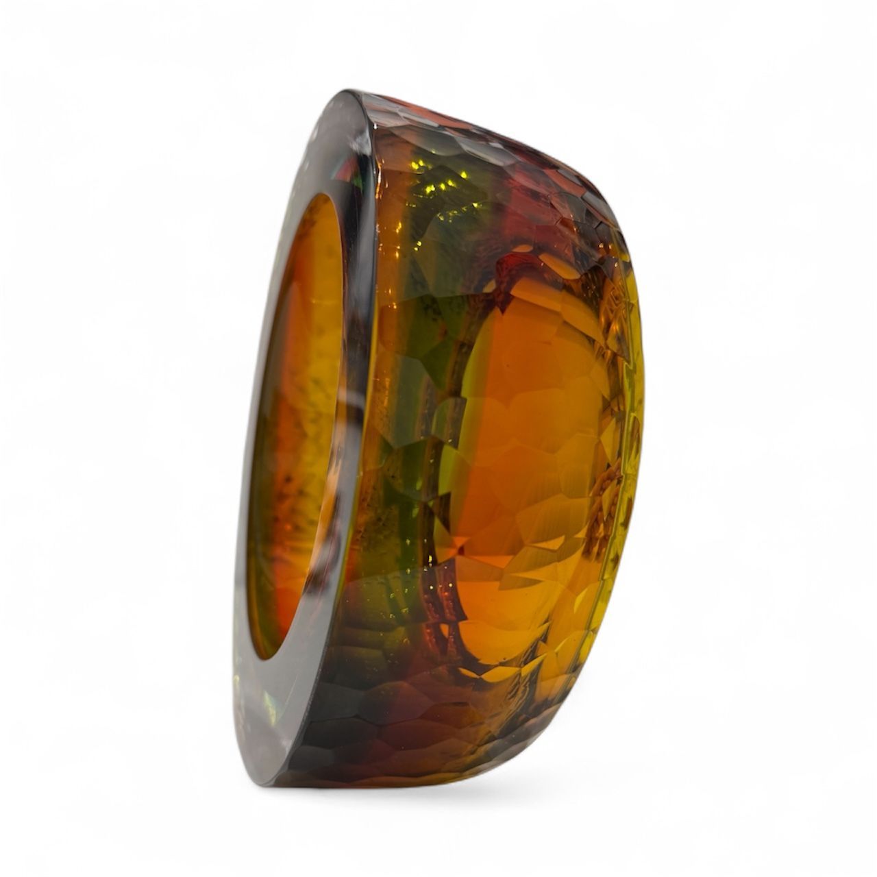 Multicolored ring with a glossy finish on a white background