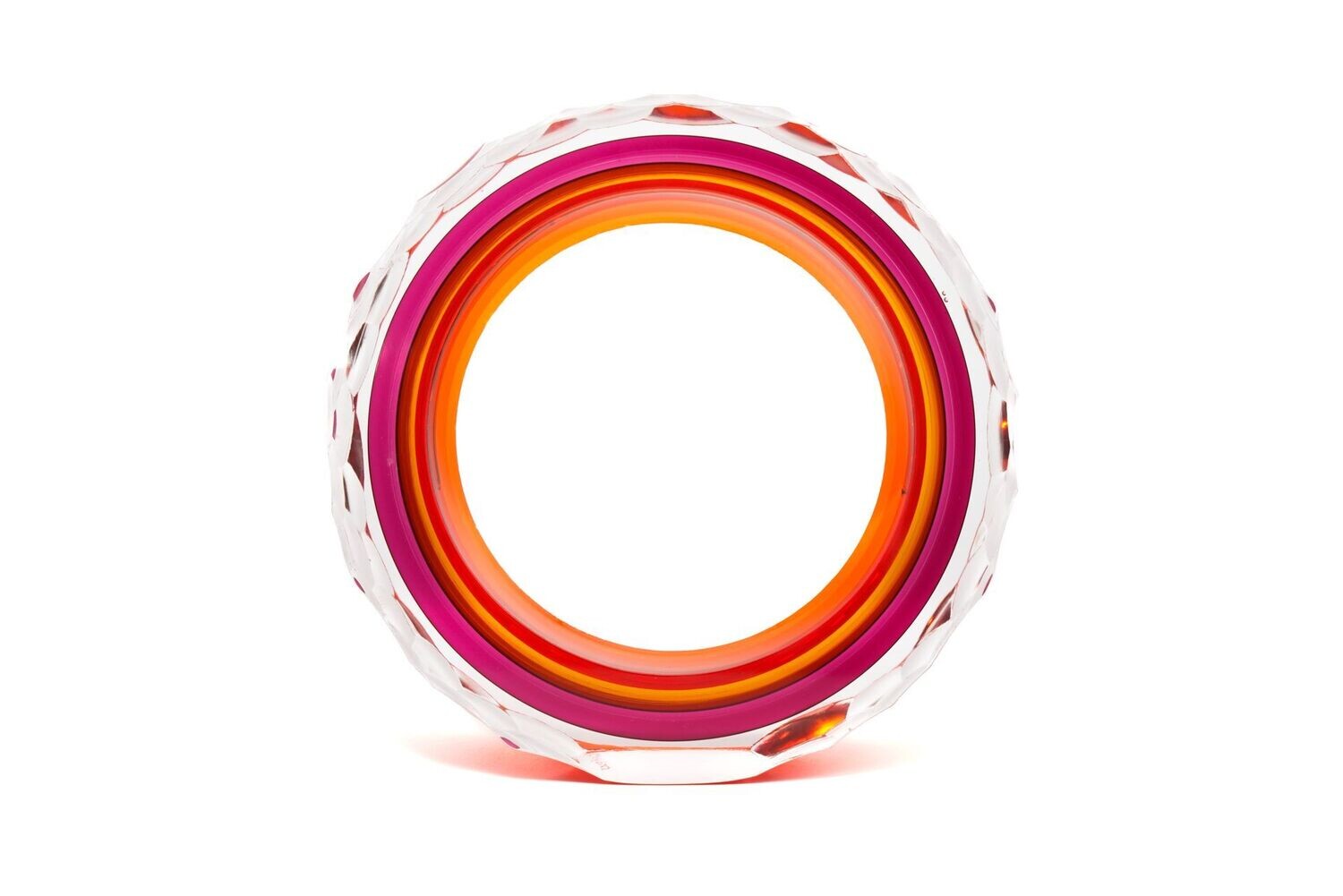 Colorful cylindrical object with concentric rings on a white background