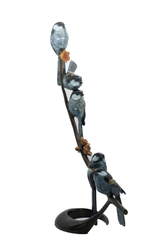 Decorative sculpture of birds on a branch with a white background