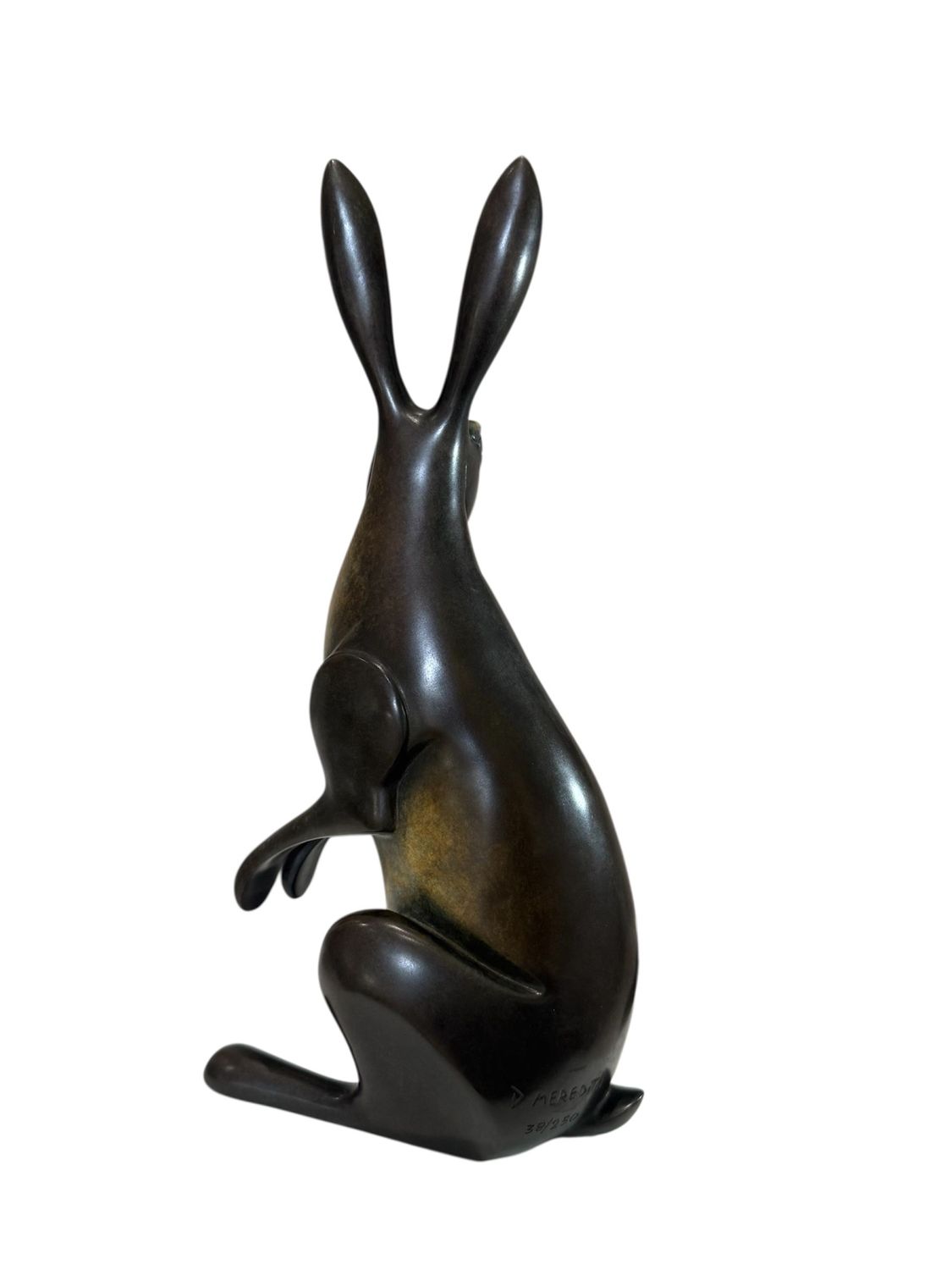 Bronze sculpture of a rabbit on a white background
