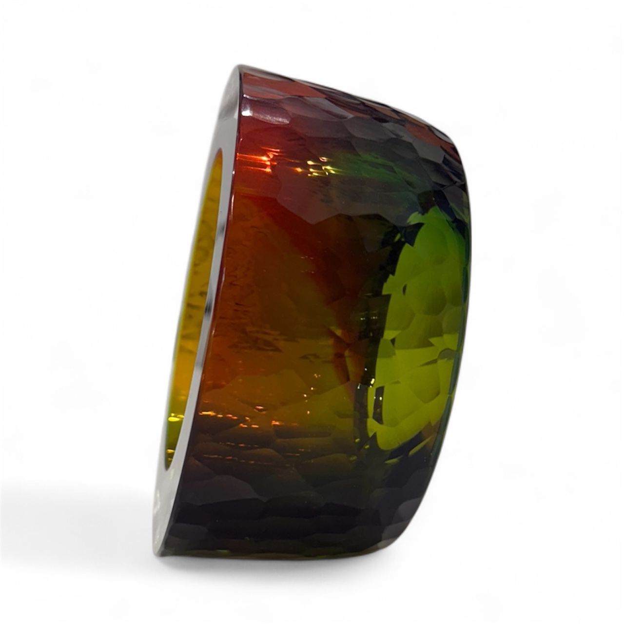 Multicolored gemstone on a white background
