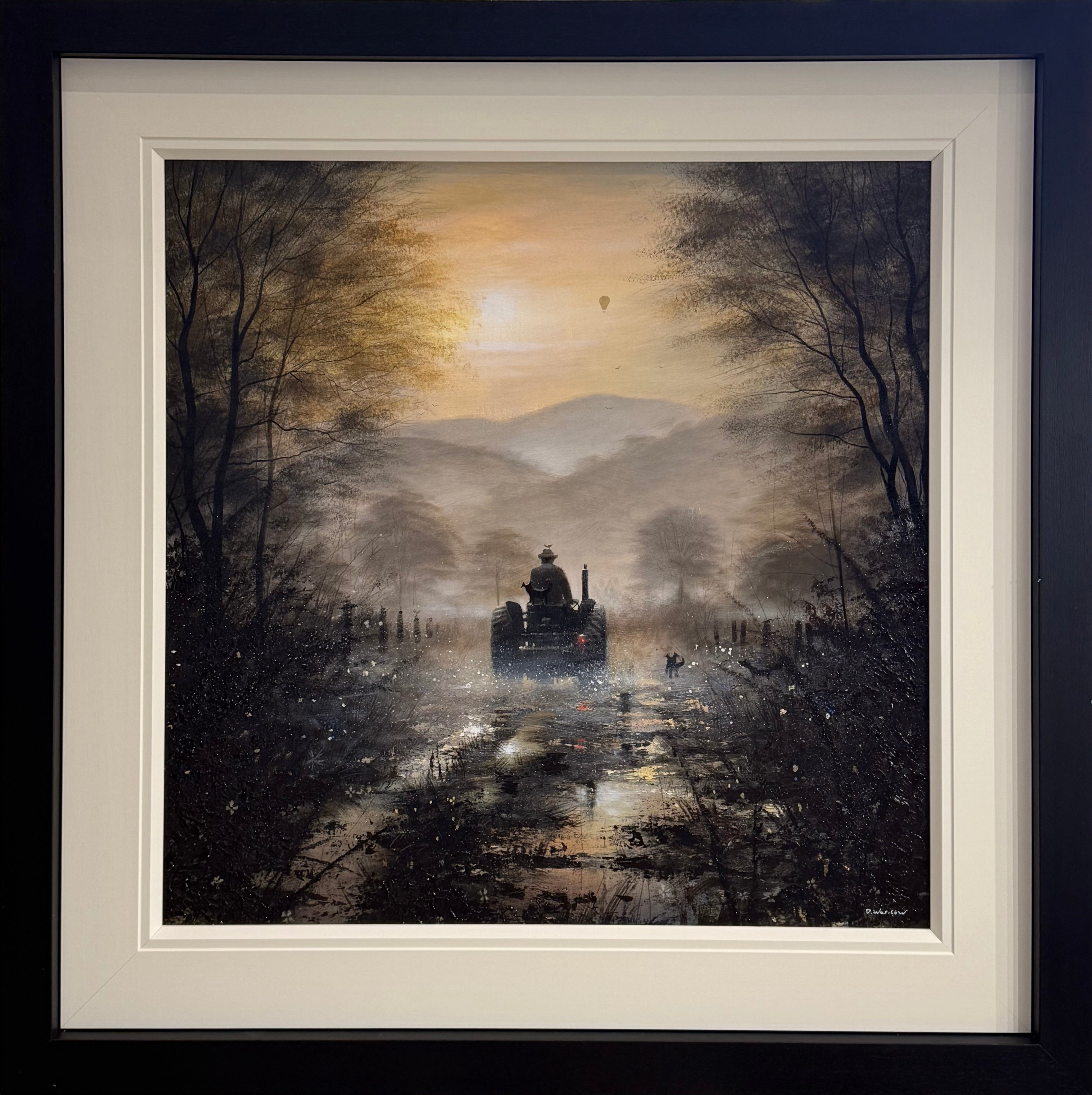 Framed artwork of a moonlit landscape with a figure on a horse-drawn cart.