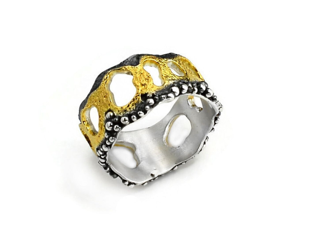 Gold and silver ring on a white background