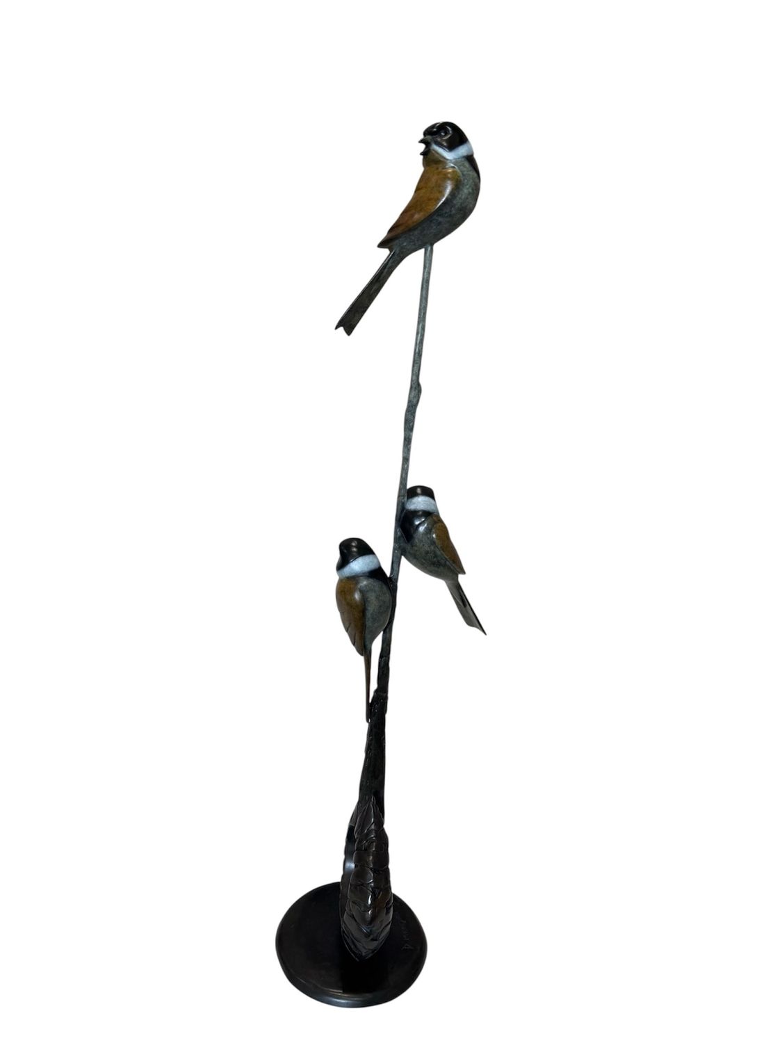 Decorative sculpture of birds on a branch with a white background
