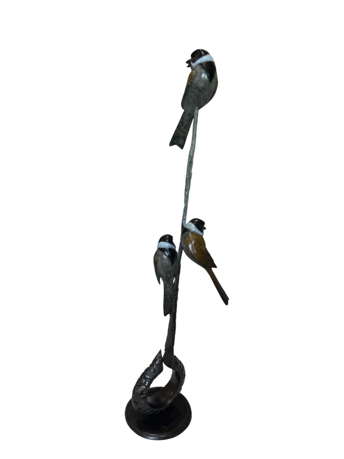 Decorative sculpture of birds on a branch with a white background