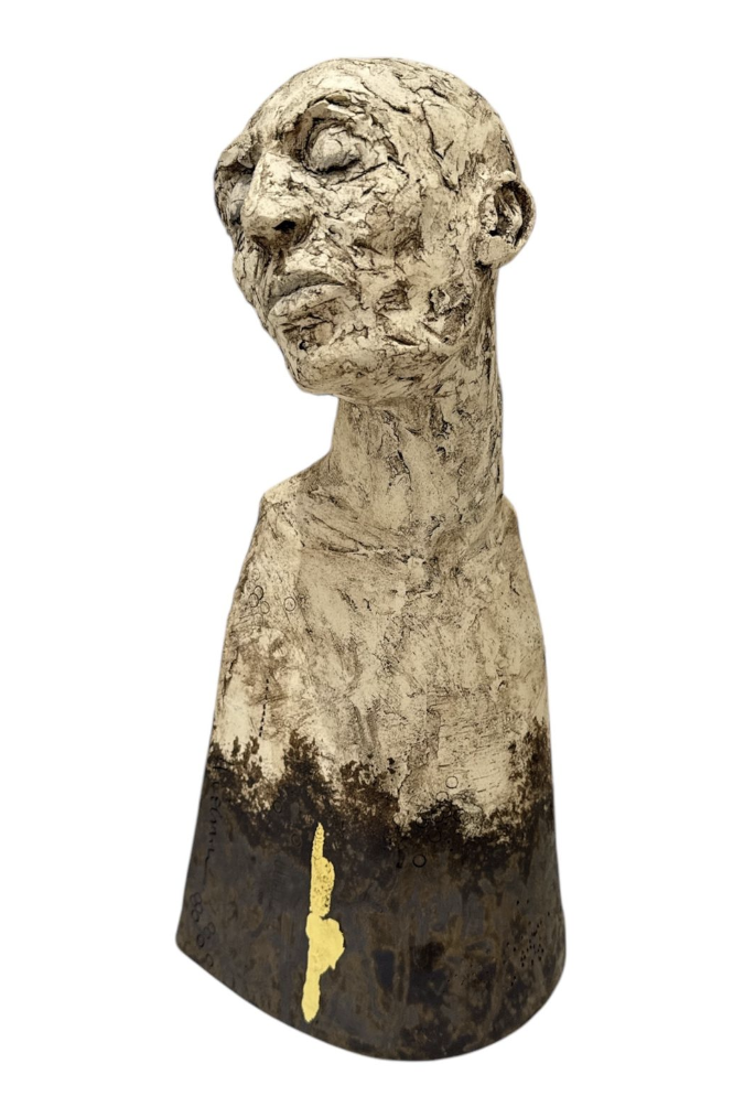 Sculpture of a human bust with a textured surface on a white background