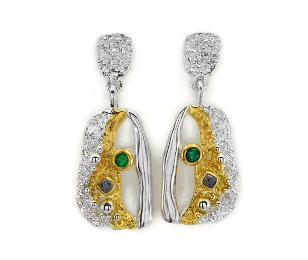 Pair of earrings with gold and silver design on a white background