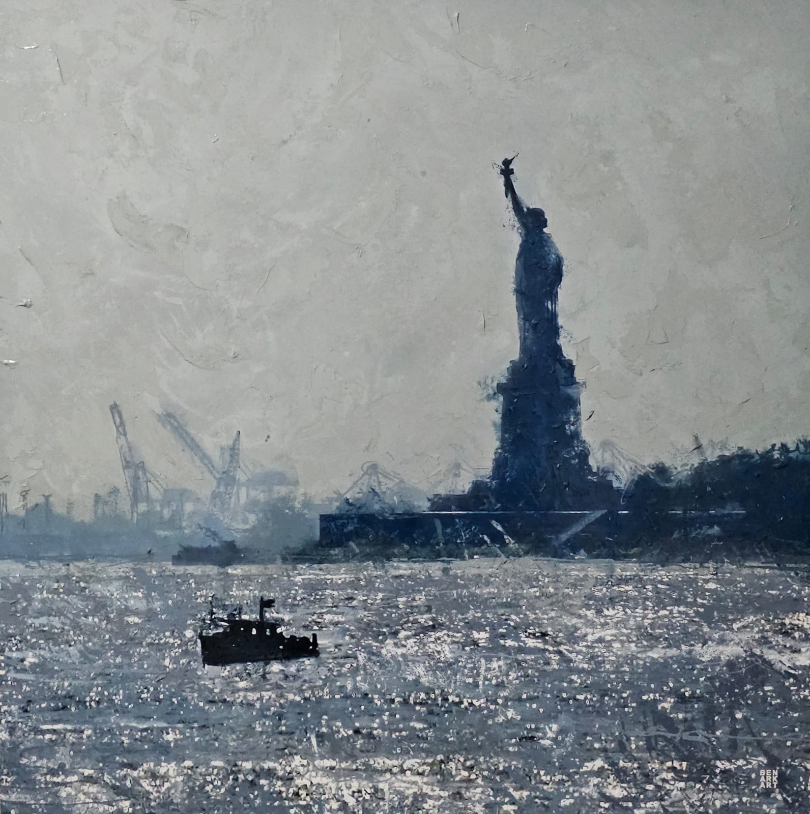 Silhouette of the Statue of Liberty with cranes in the background on a gray day.