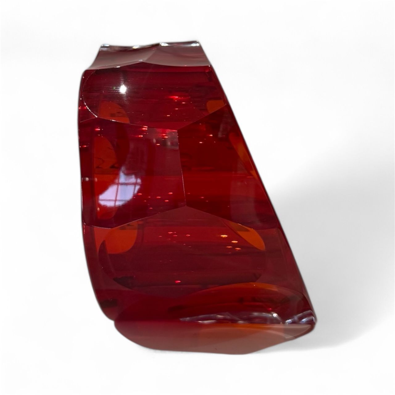 Red car tail light on a white background