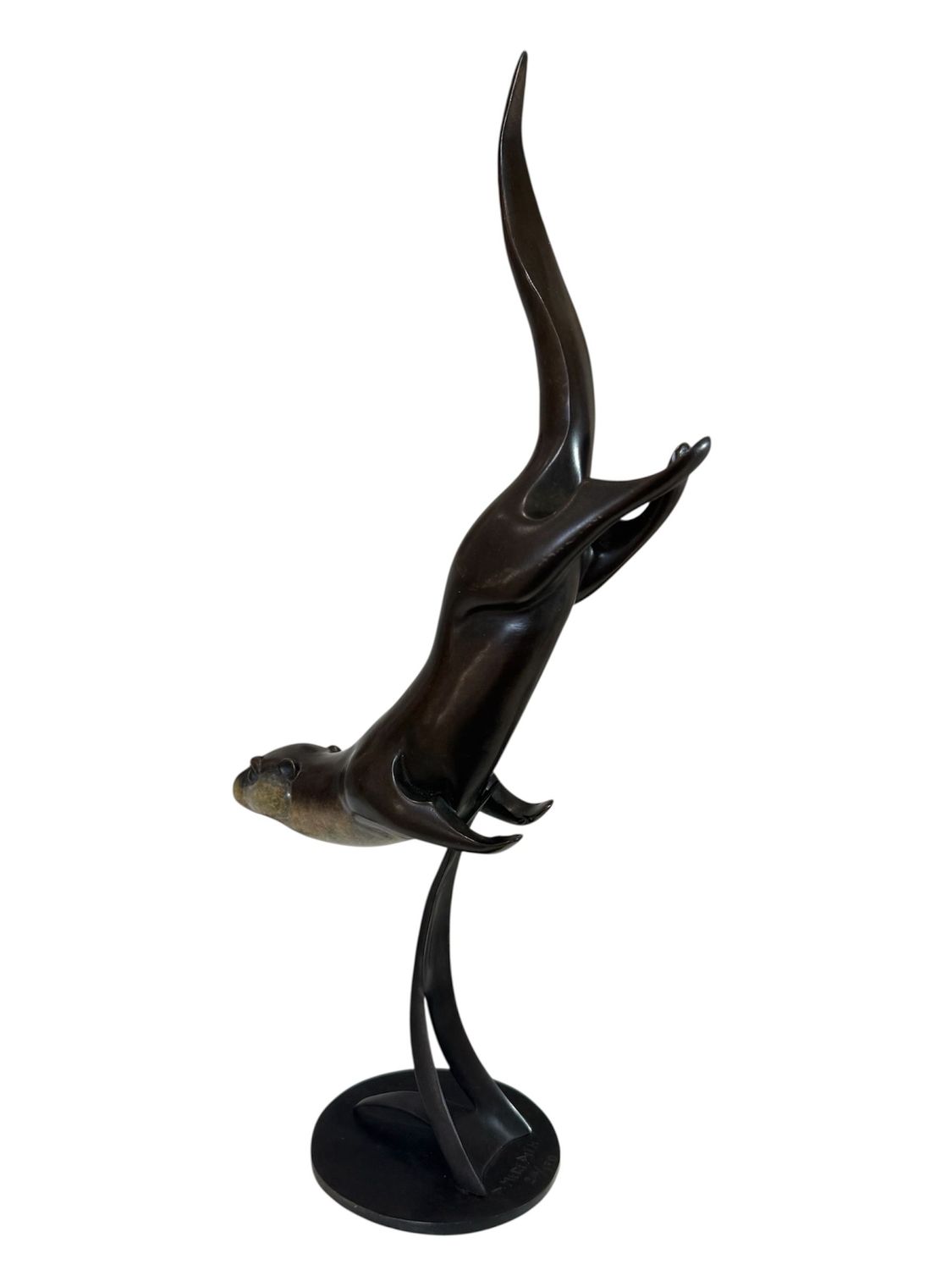 Bronze sculpture of a otter with large antlers on a white background