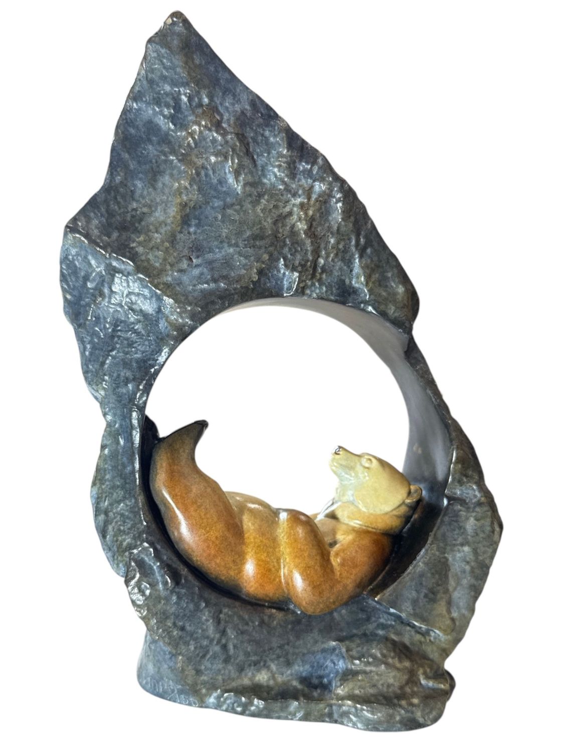 Decorative stone sculpture with a naturalistic design on a white background