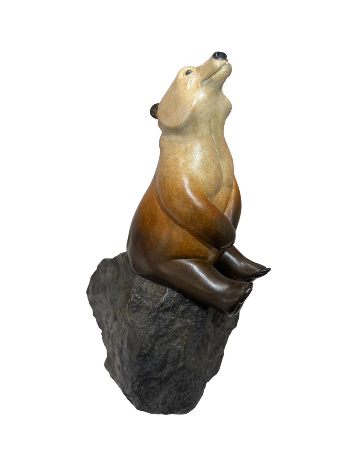 Statue of a bear on a rock with a white background