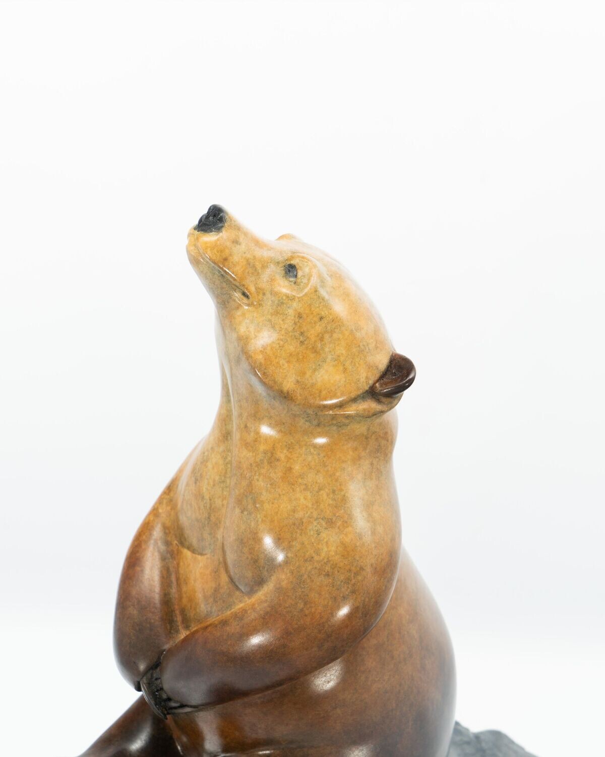 Brown bear sculpture on a white background