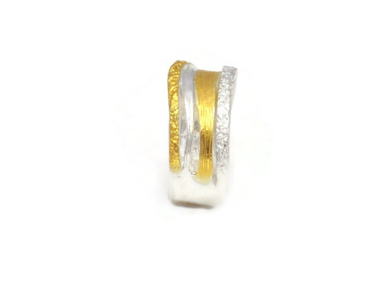 Gold and silver hoop earring on a white background
