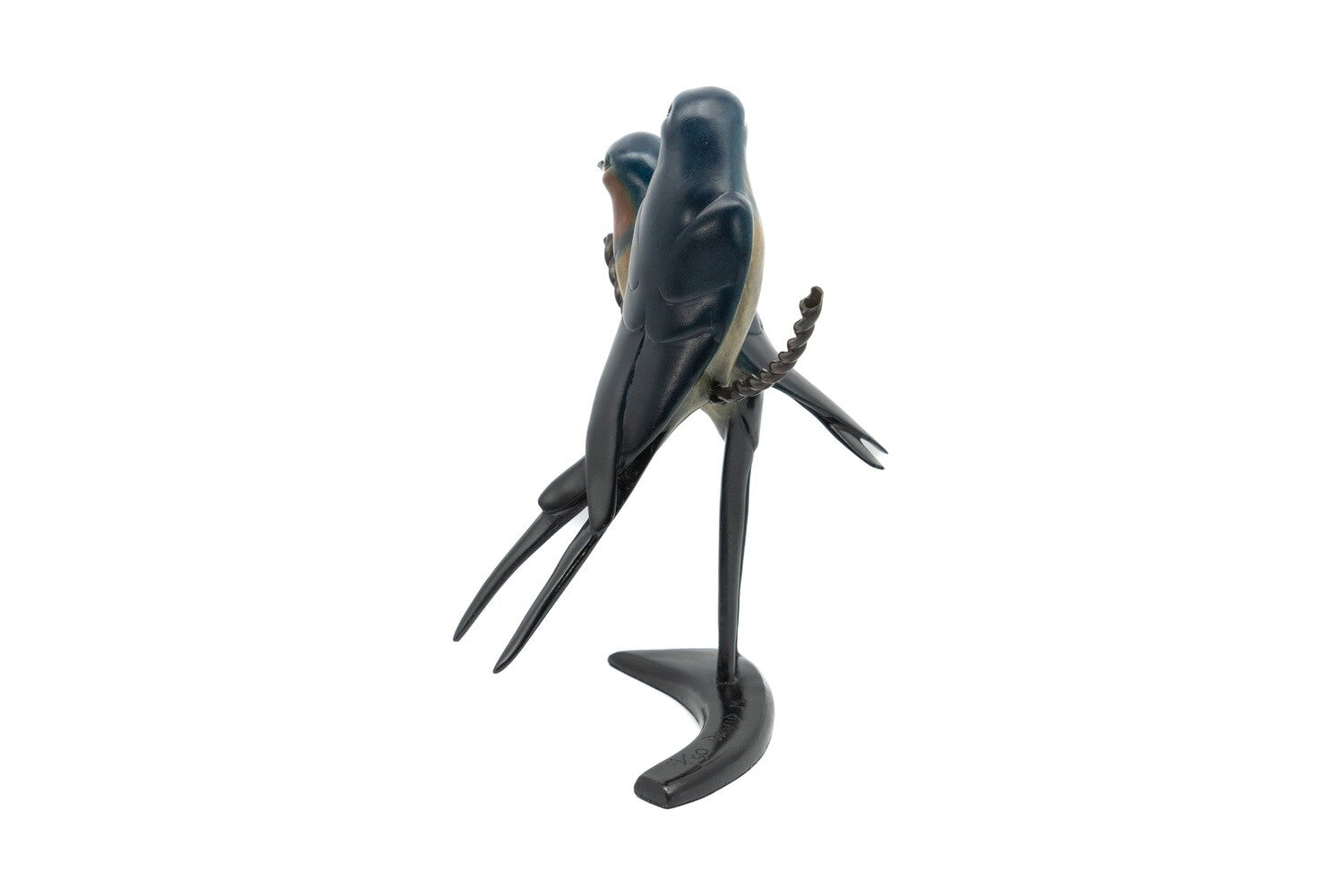 swallows on a ire bronze figure on a white background