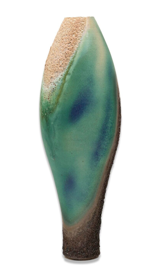 Ceramic vase with green and brown glaze on a white background