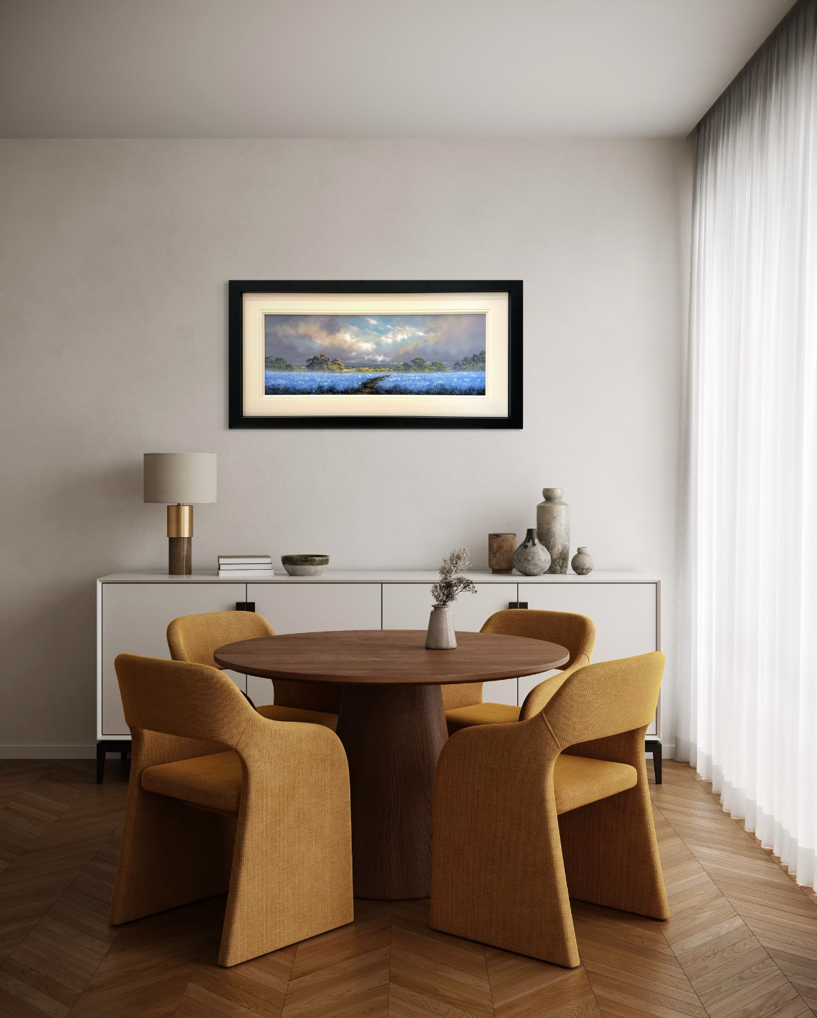 Dining room with wooden table and chairs, white sideboard, and framed artwork on the wall.