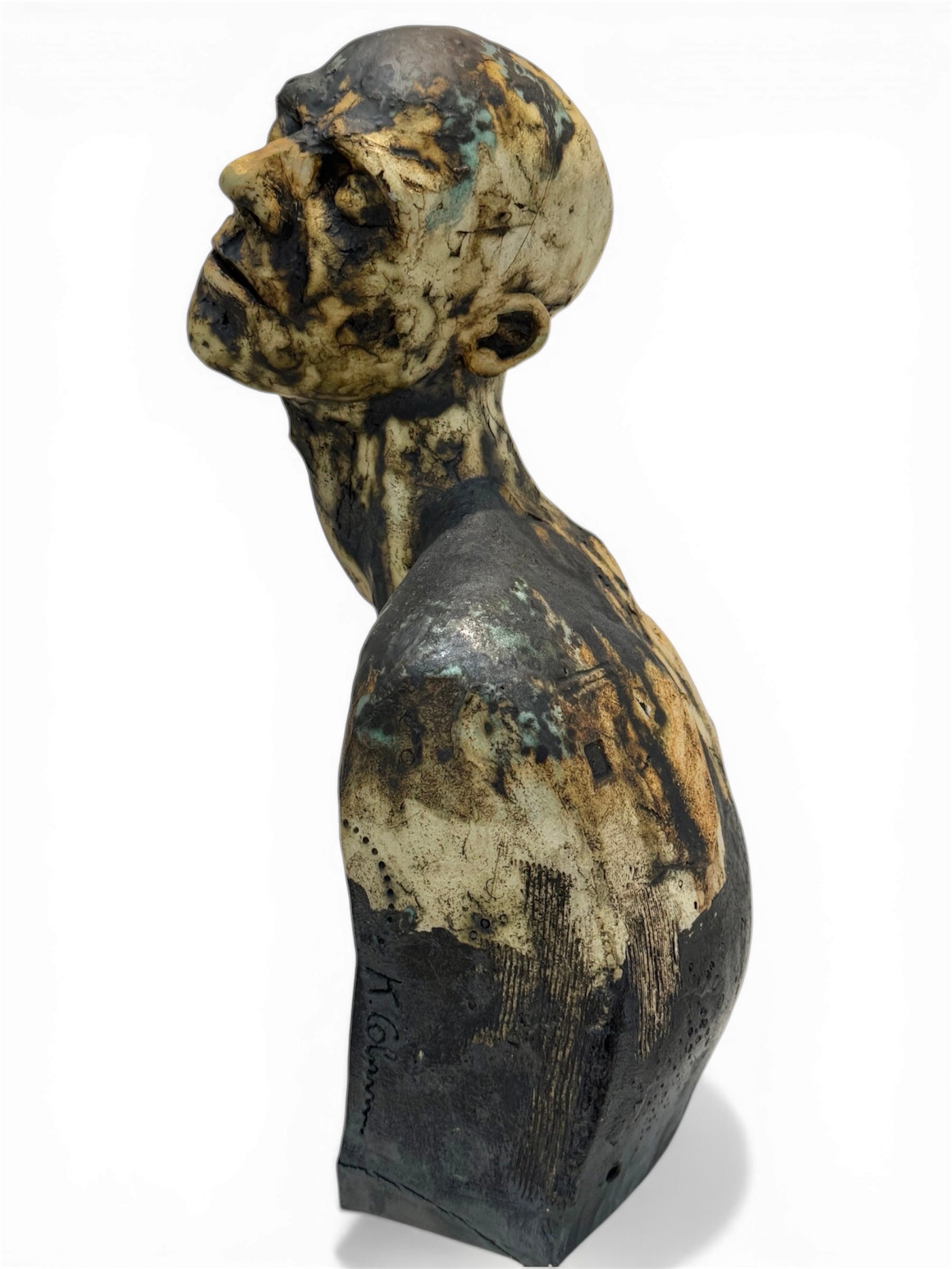 Ceramic sculpture of a figure with a detailed face on a white background