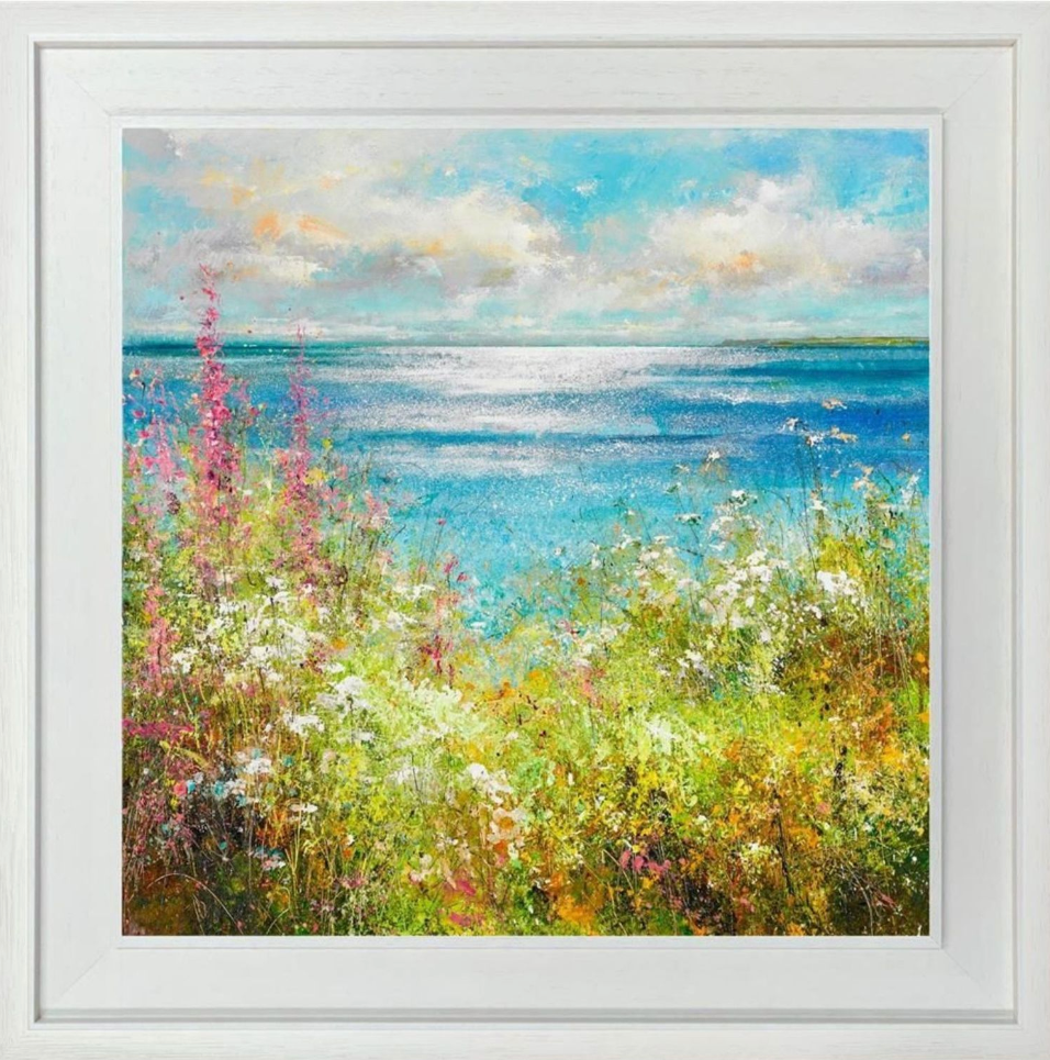 Framed artwork of a landscape with flowers and a blue sky.