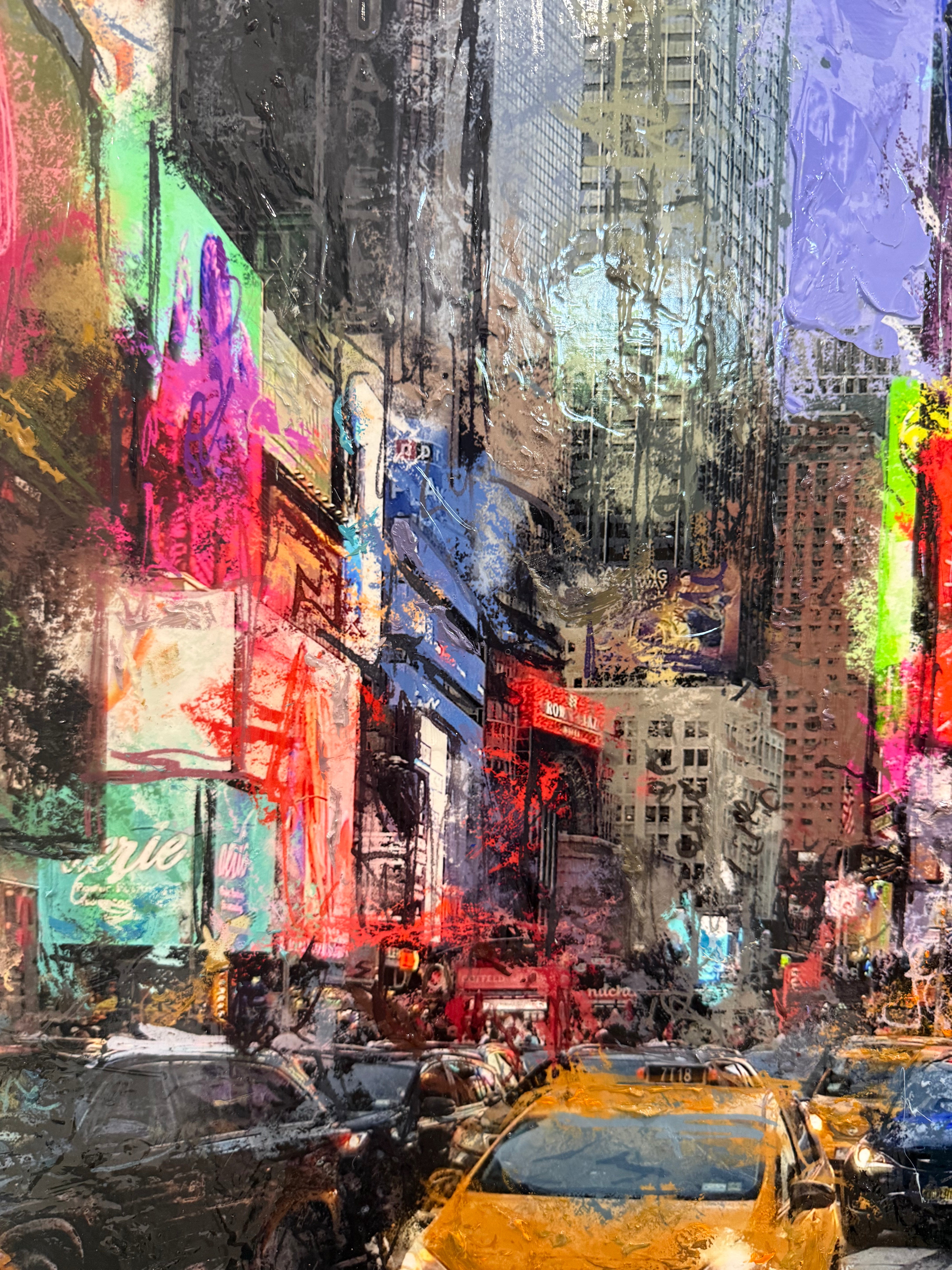 Colourful abstract painting of a city street scene with buildings and taxis.