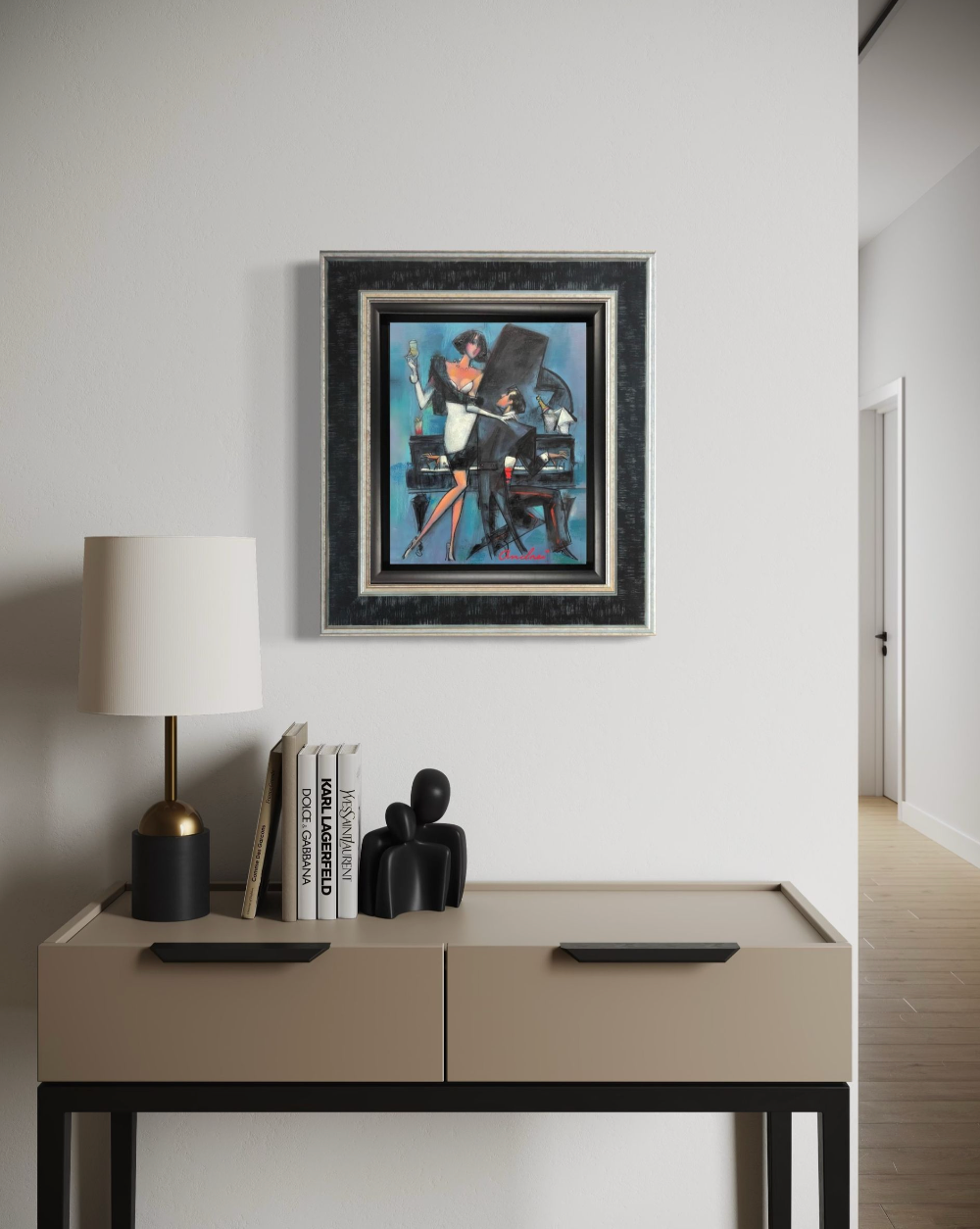 Modern interior with a side table, lamp, books, and framed Andrei Protsouk on a white wall.