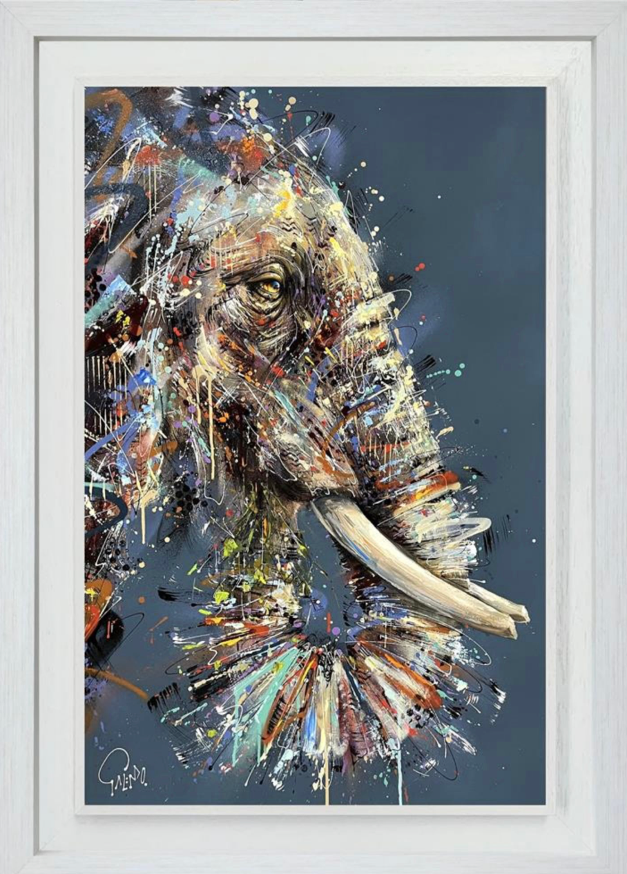 Framed abstract painting of an elephant head with colorful splashes on a dark background