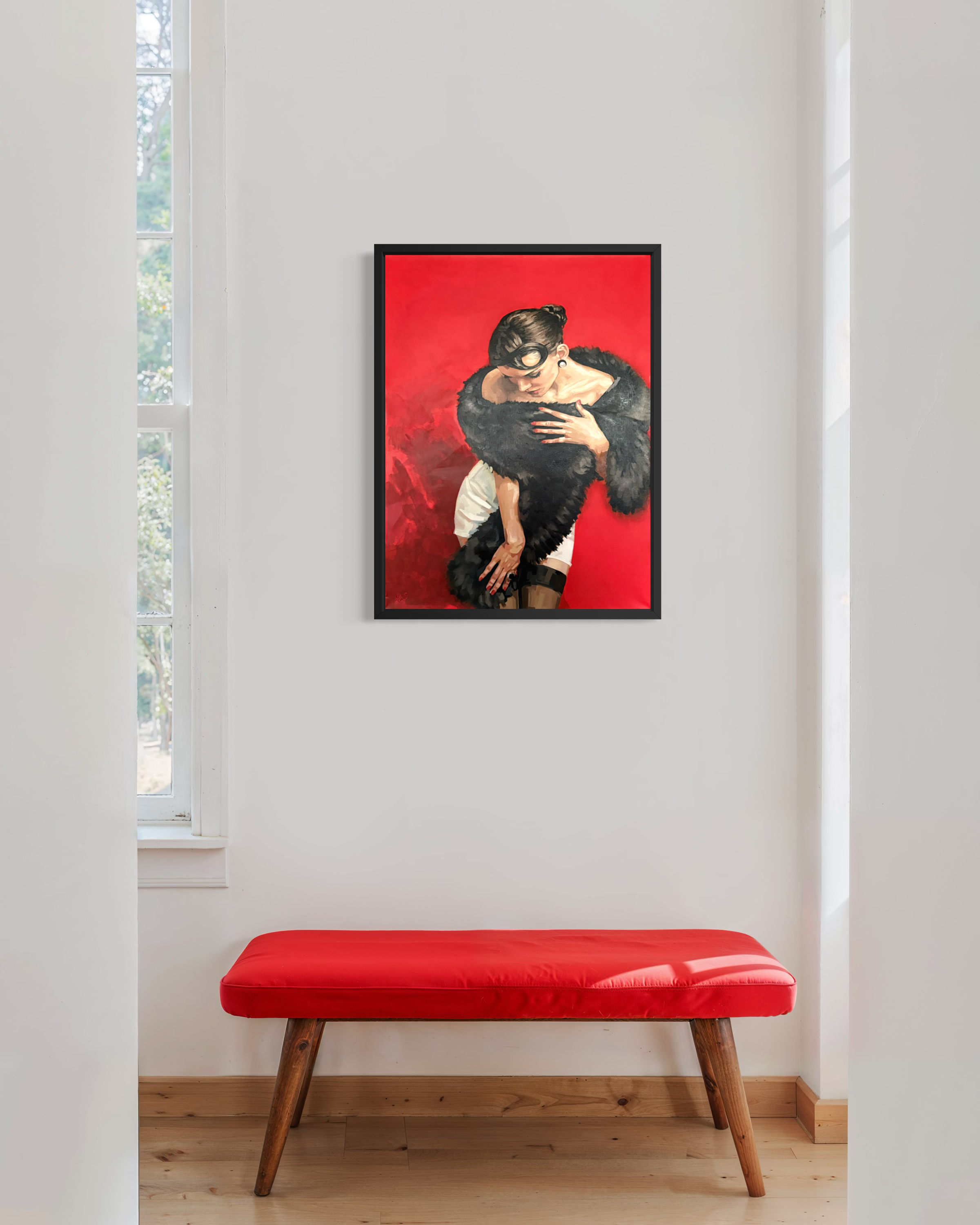A painting of an elegant woman with black hair tied up in a bun wearing a white skirt and black fur wrap against a red background hanging in a kitchen on a white wall behind a contemporary white marble island