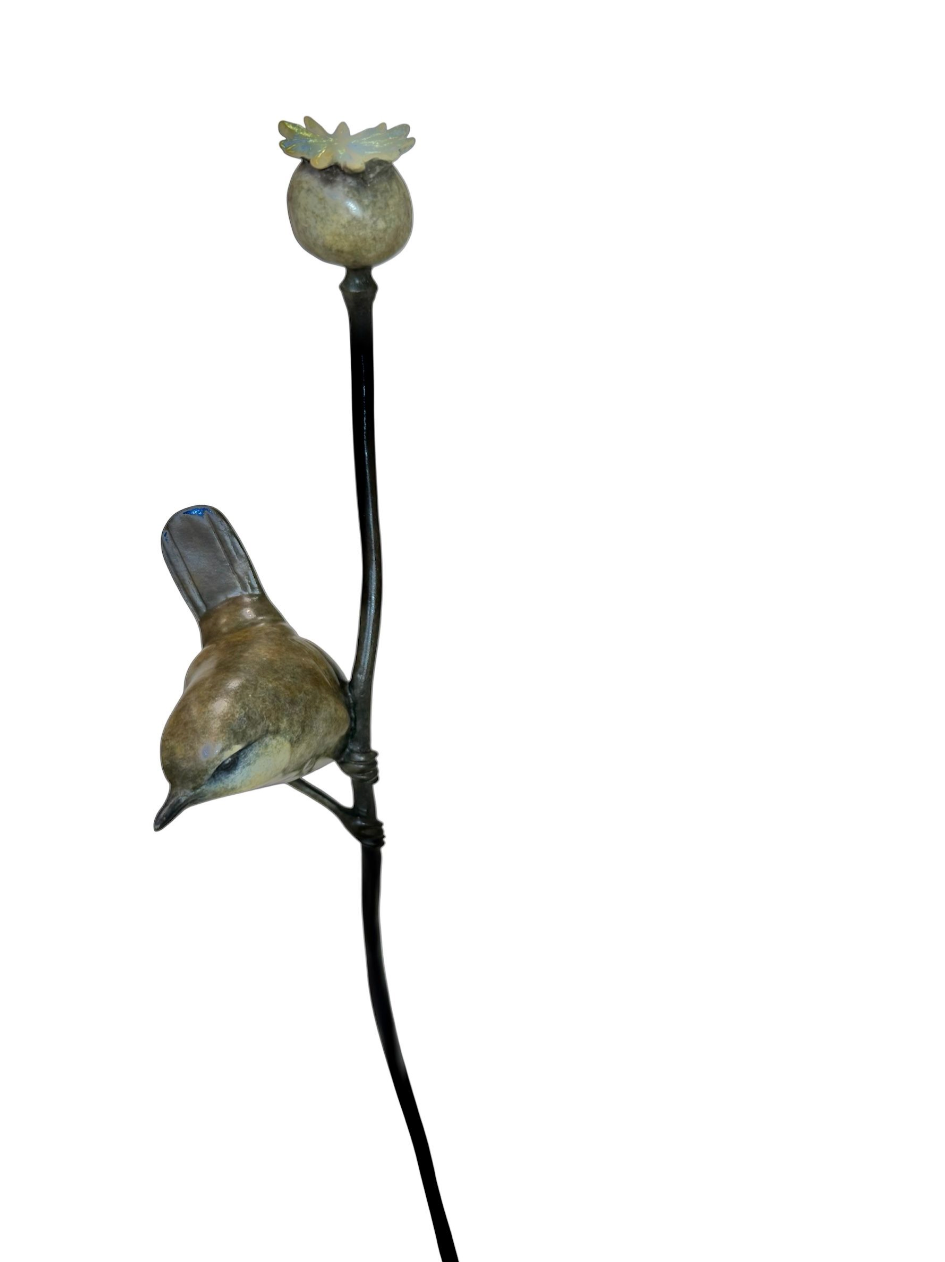 bronze wren and flower sculpture on a white background