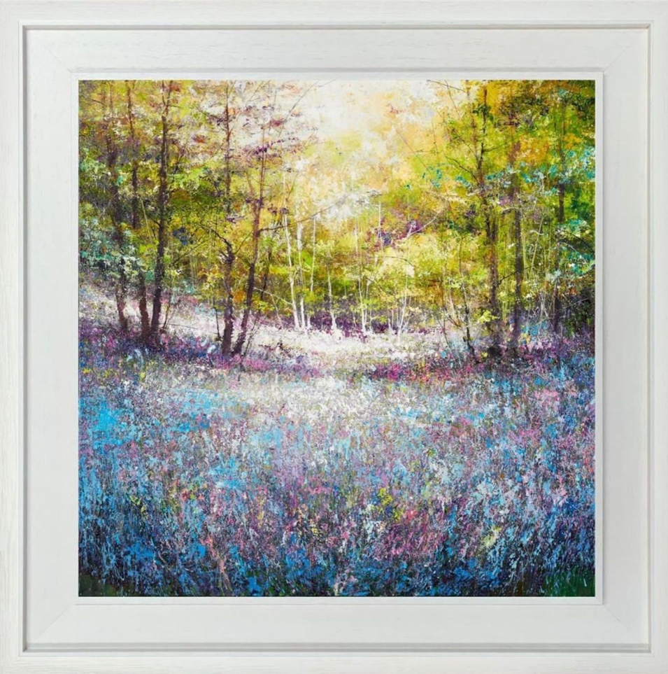 Framed artwork of a forest scene with blue flowers and trees.