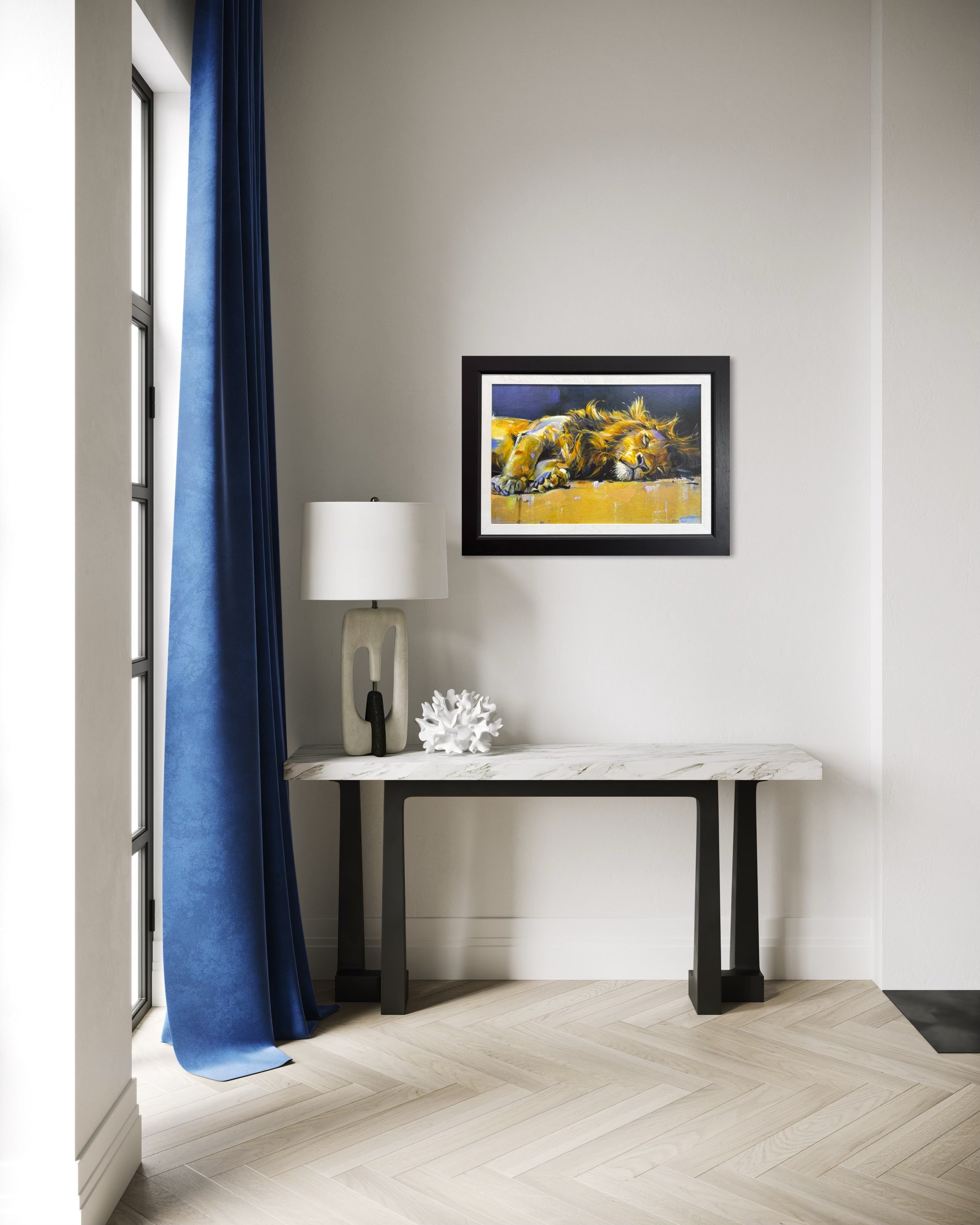 Modern interior with a console table, lamp, and framed lion artwork on a wall.