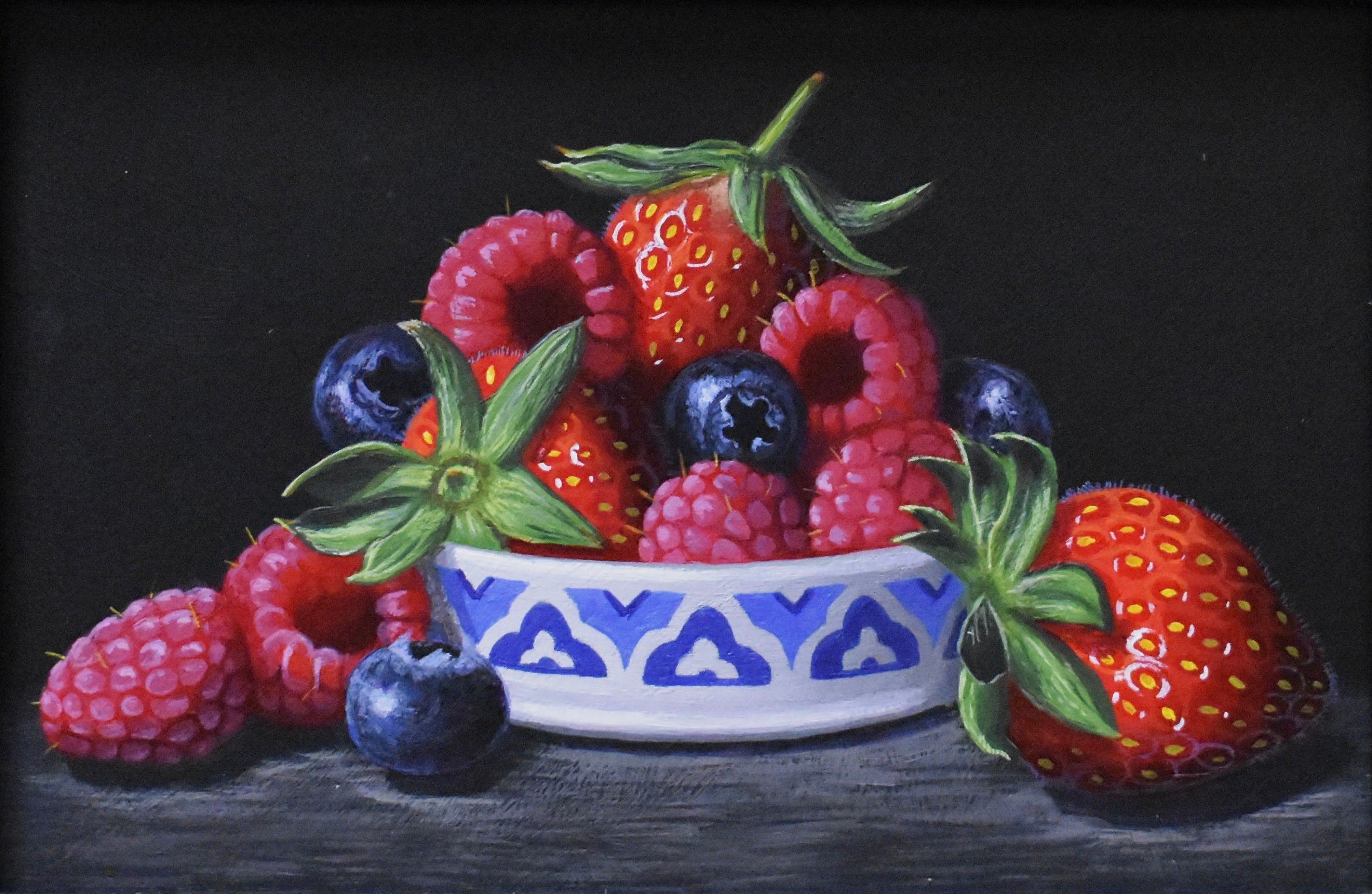still life painting of a white and blue ceramic bowl filled with raspberries, blueberries, strawberries on a dark background