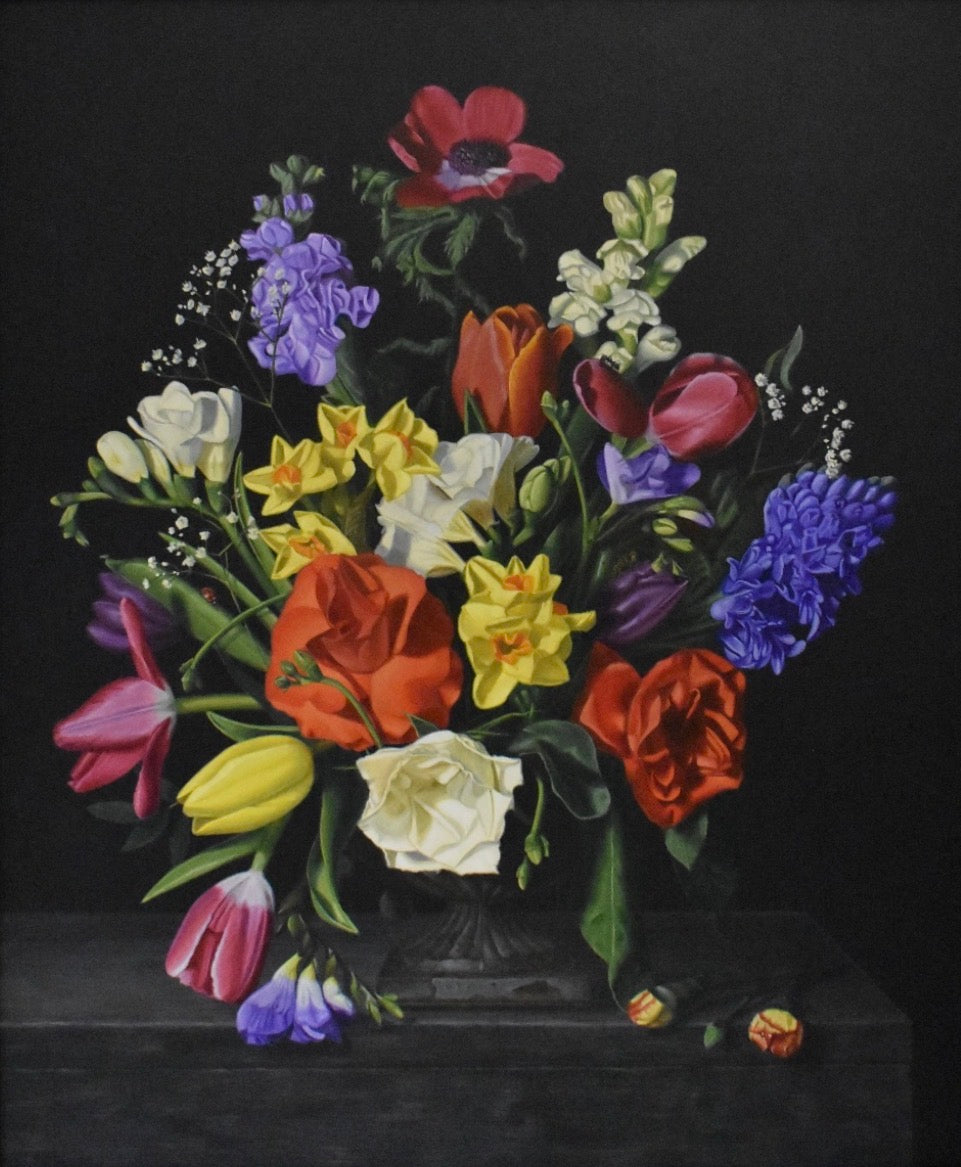 Colorful bouquet of flowers in a vase on a black background