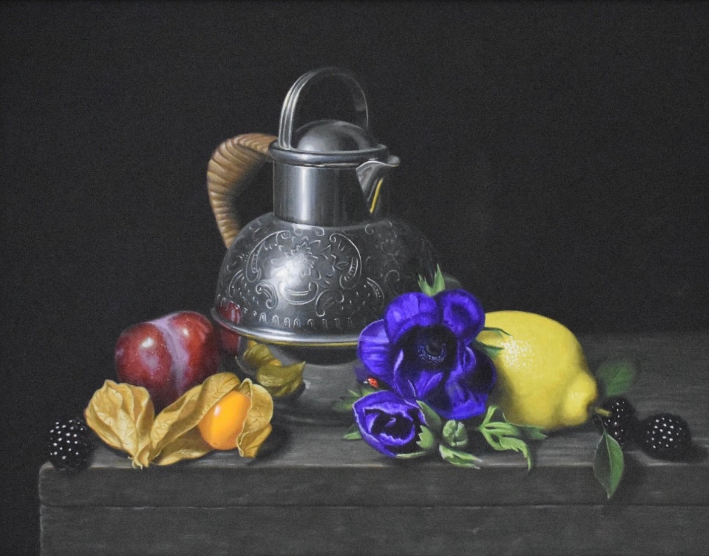 Still life painting with a silver teapot, fruits, and flowers on a dark surface.